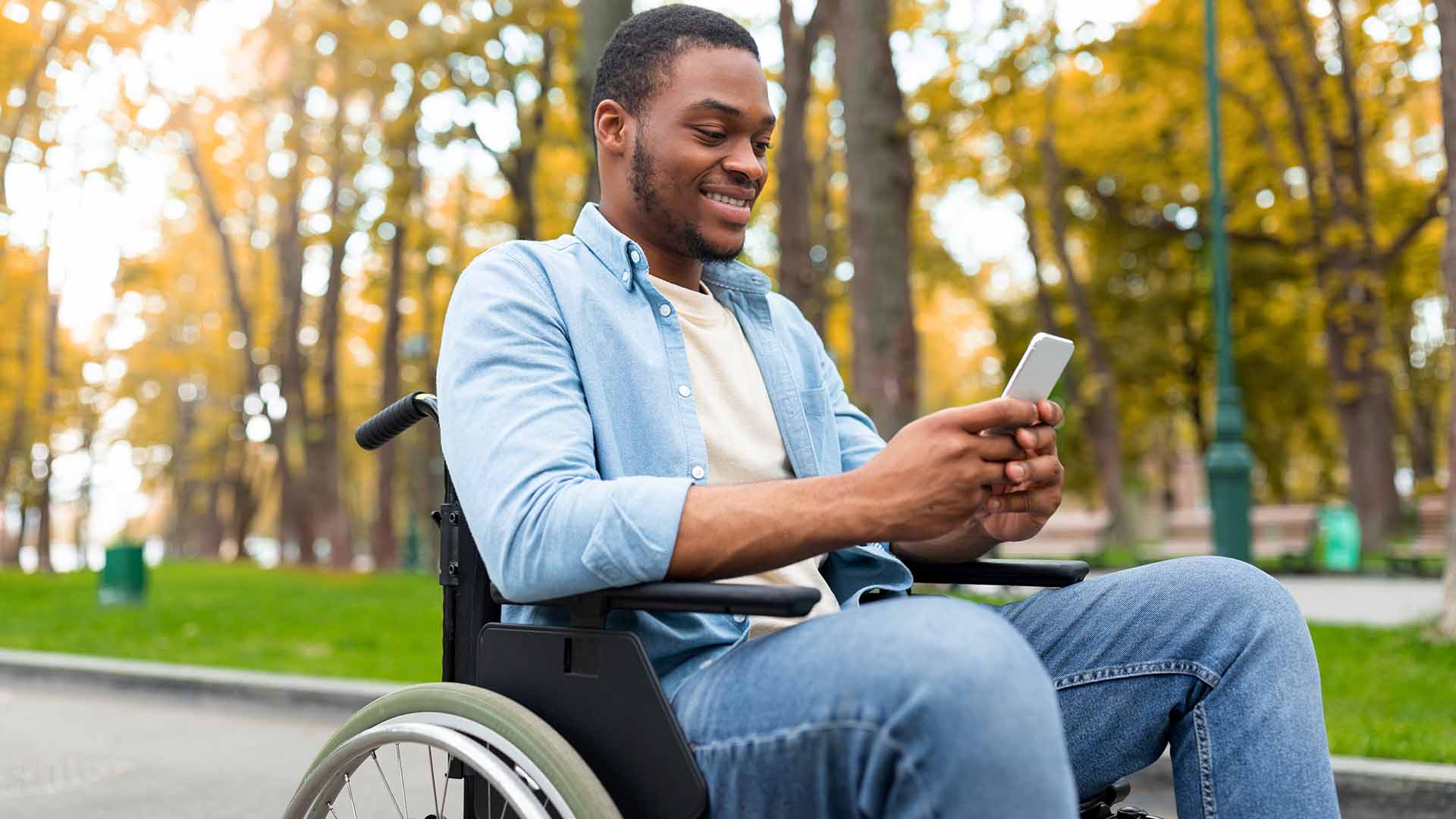 Man in wheelchair with phone