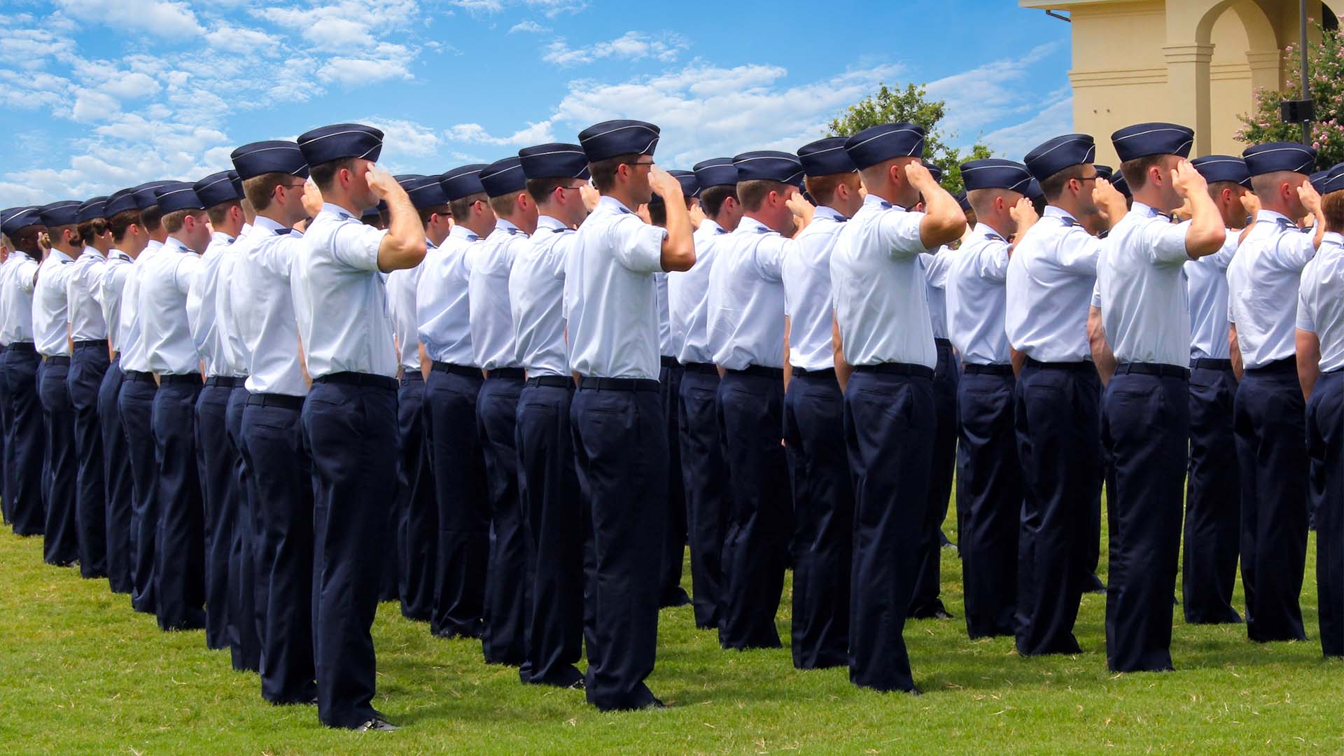 Formation of Airman saluting outside