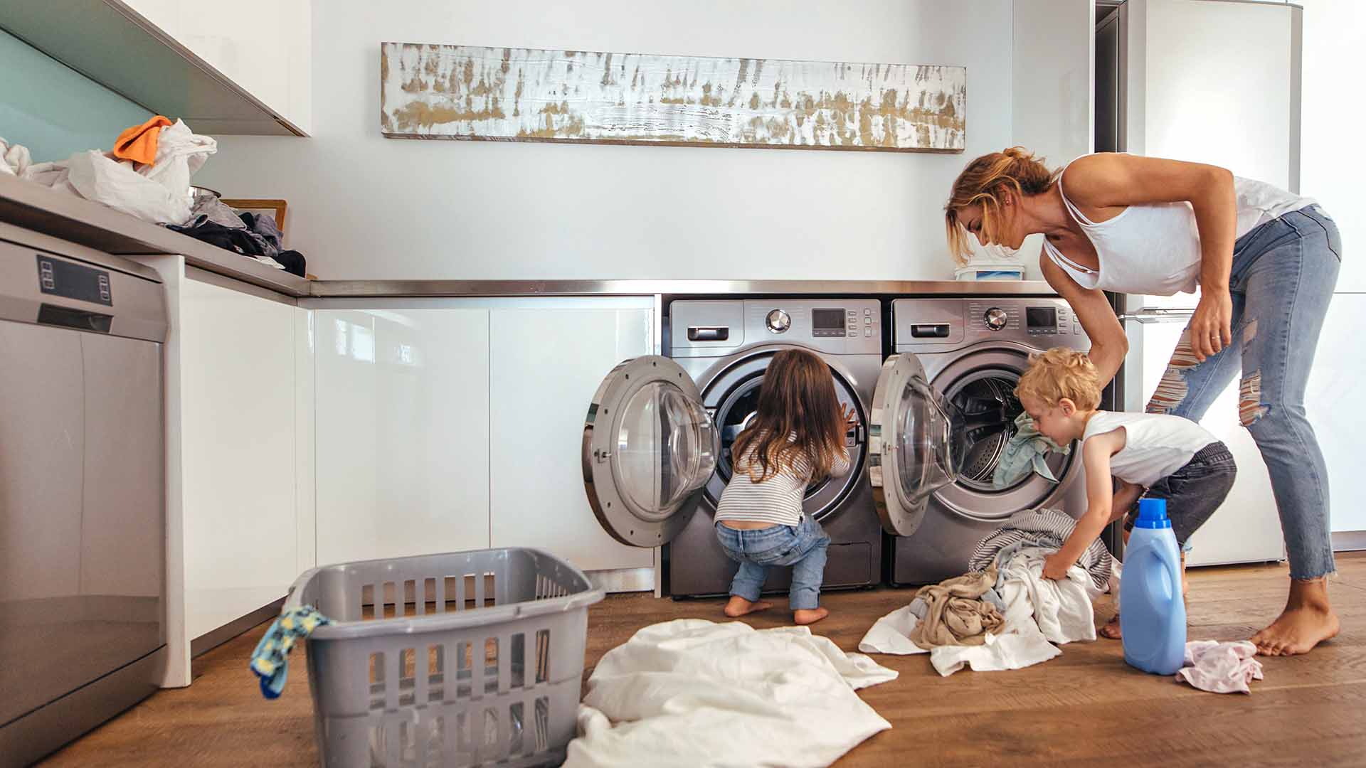 Mother and children doing laundry together